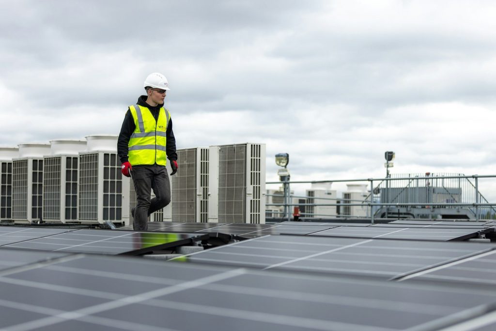 HVAC Installer at the rooftop inspecting for Air Conditioning Services in Youngstown, FL