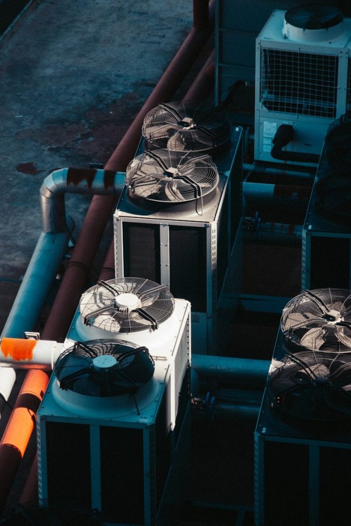 a group of air conditioners sitting next to each other for people searching Air Conditioning Services near me