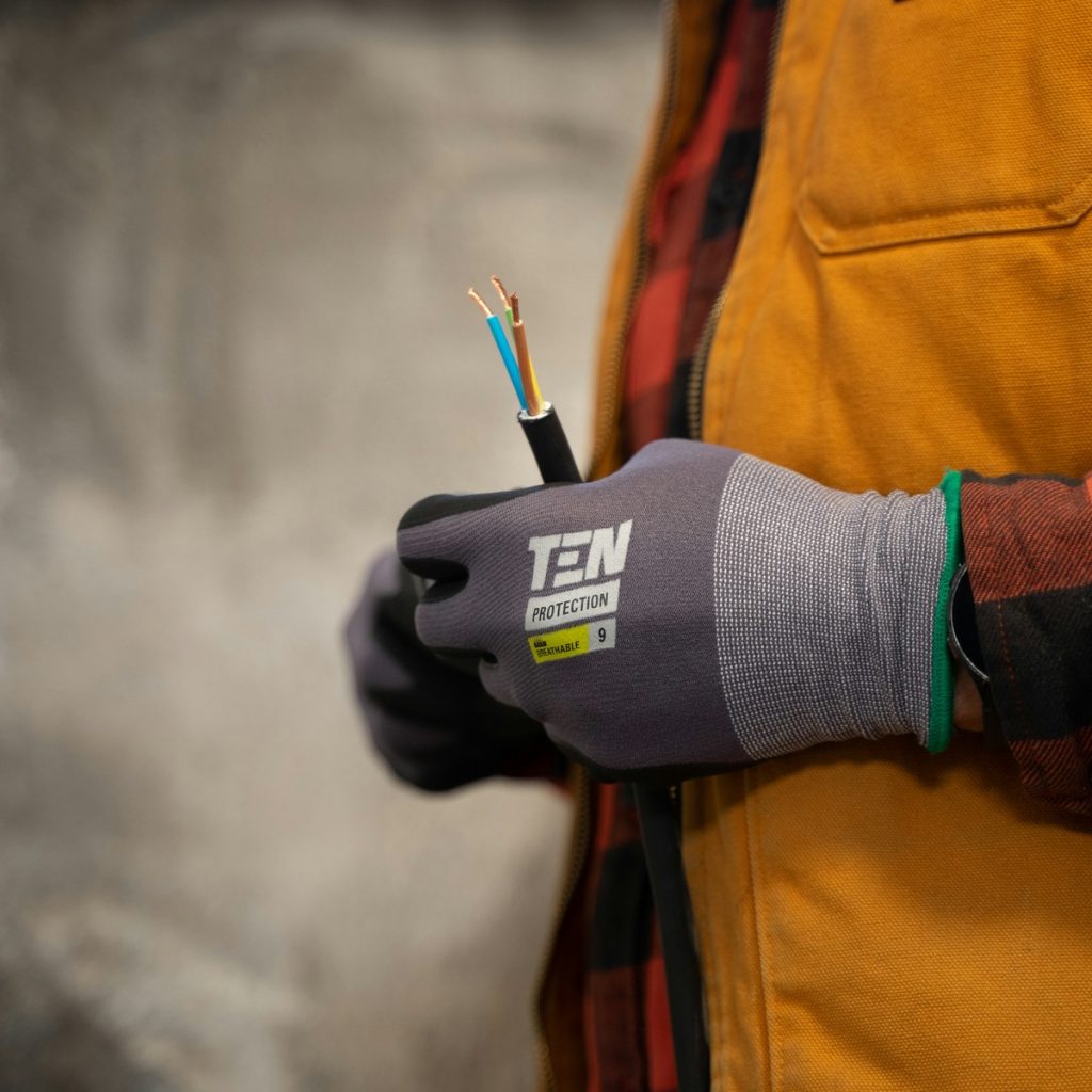A technician sealing an insulated ventilation line as conditioned air moves through the system — the everyday craft behind quality Ductwork and Ventilation Services near me.